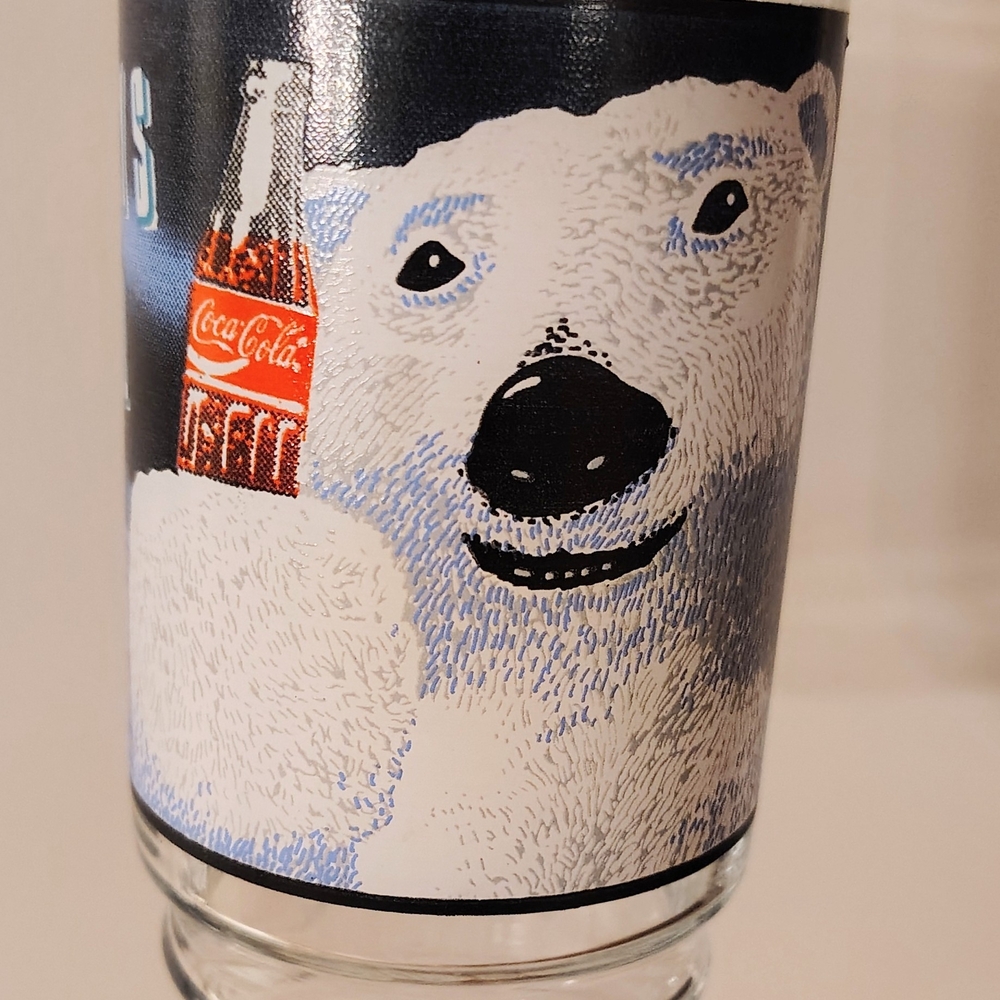 Coca-Cola Christmas Themed Glasses.  1 Polar Bear, 1 Holiday Pine, 2 Santa.
